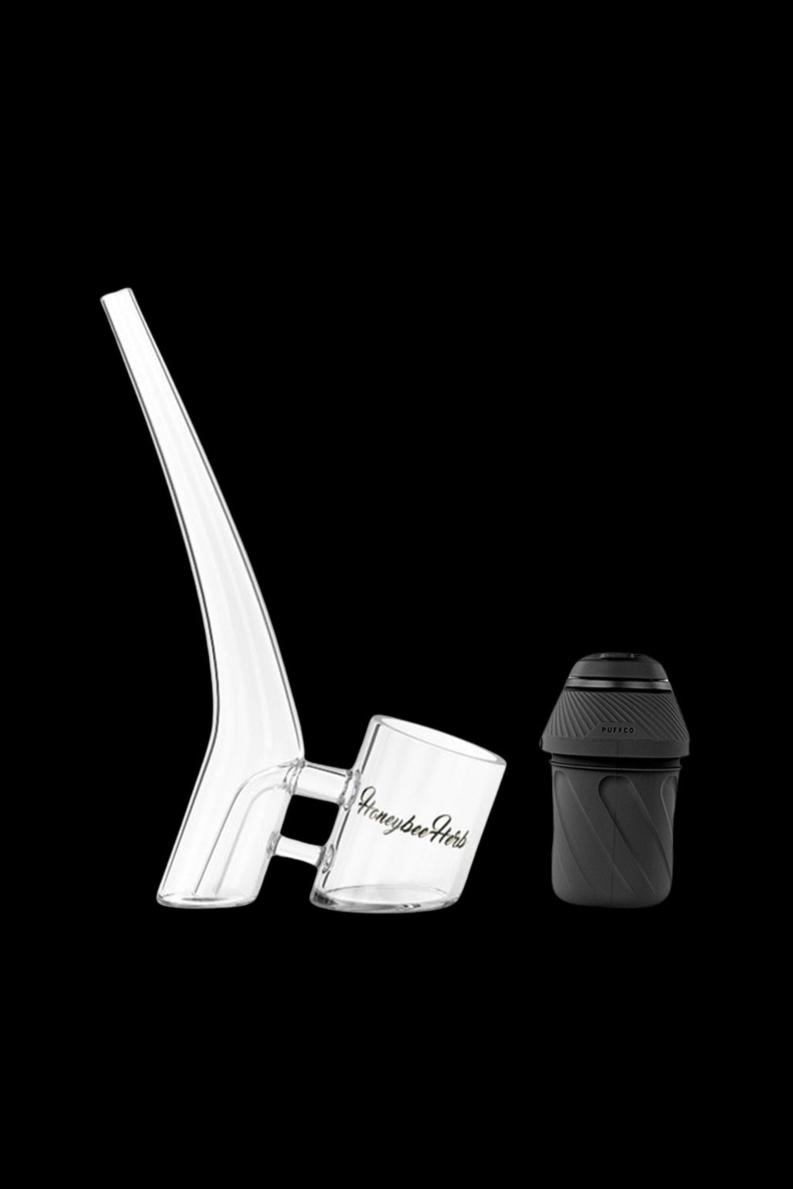 Puffco Peak Pro atomizer and glass bubbler for vaporizing cannabis concentrates.