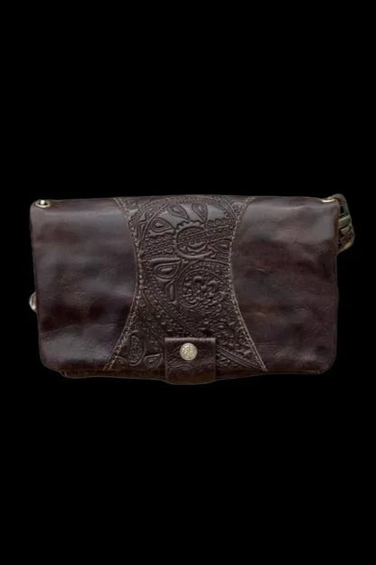 Dark brown leather smell-proof bag with embossed floral detailing.