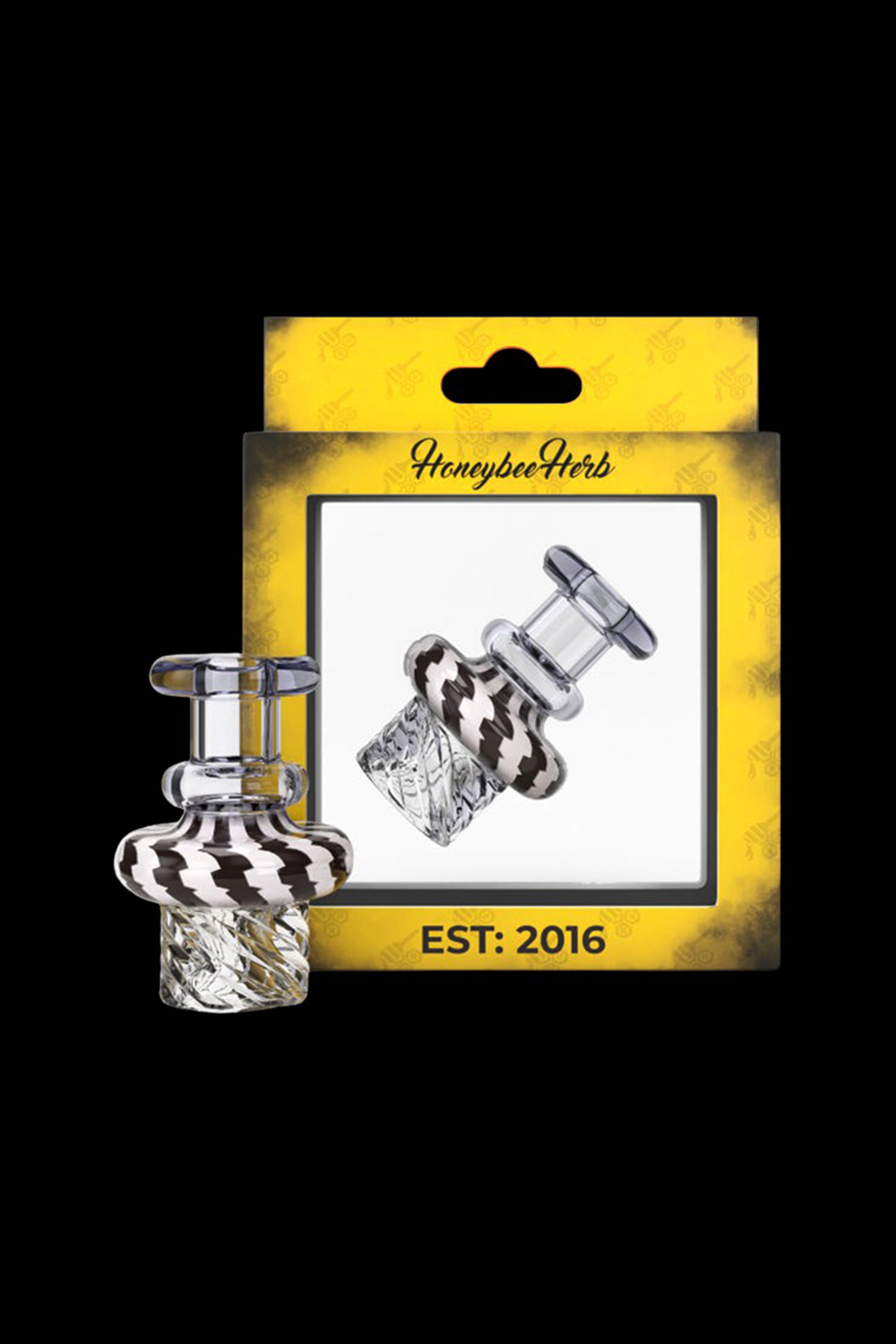 Glass cannabis oil rig attachment in packaging labeled "Honeybee Herbs Est. 2016".