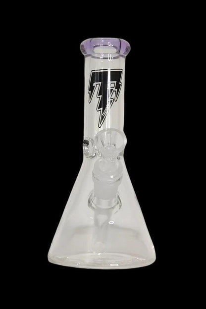 Clear glass beaker bong with purple accents and intricate internal diffusion perc, isolated on a black background.
