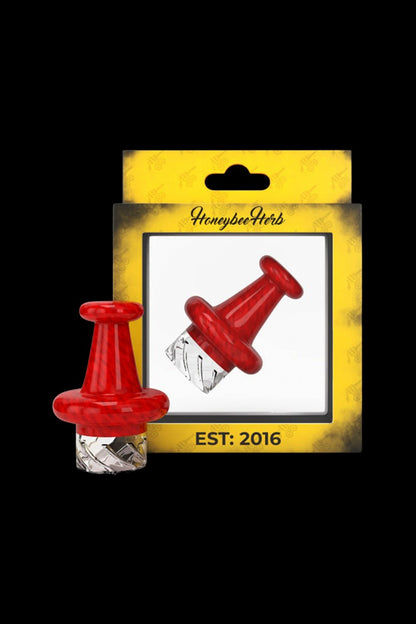 Close-up front view of the red Honeybee Herb Colorful Classic Vortex Carb Cap centered against its yellow branded packaging.