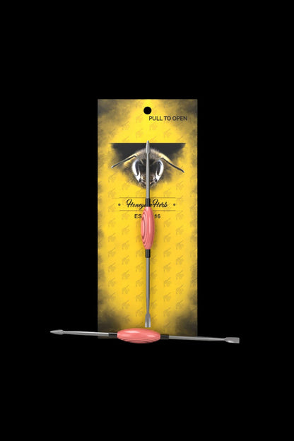 Cannabis dab tool packaged in a bee-themed, pull-open box.