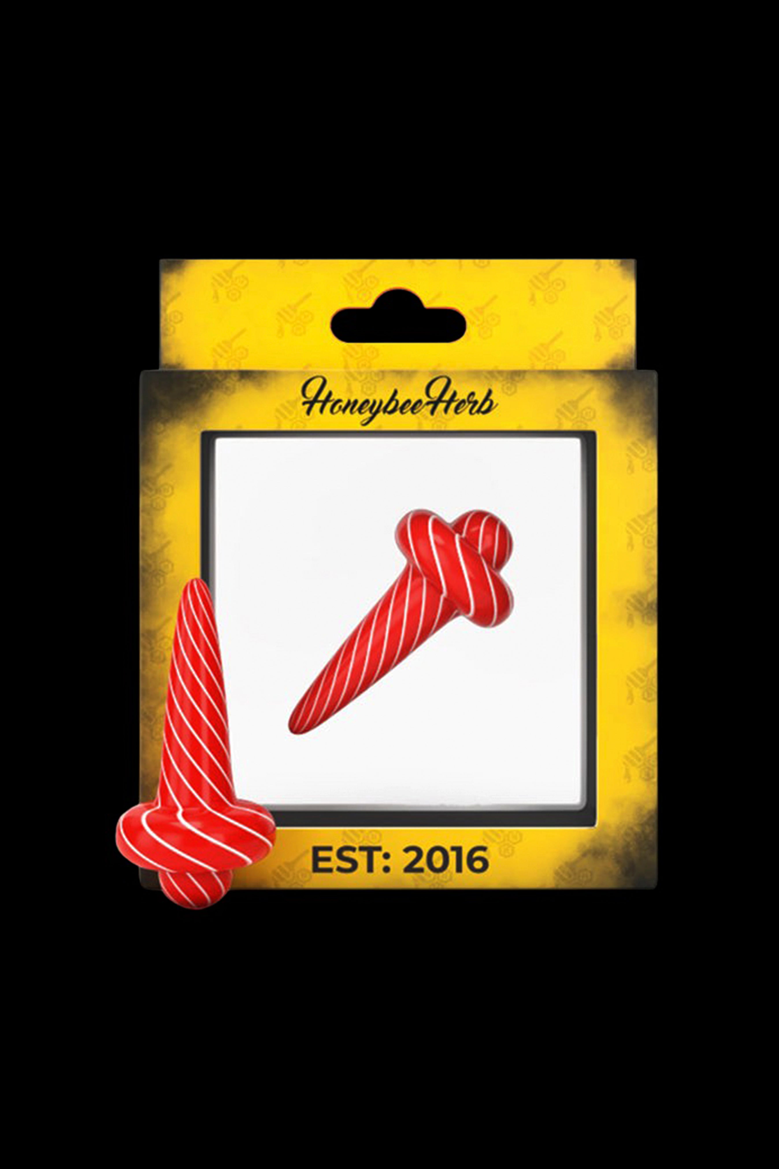 Red cannabis dab tool packaged on a yellow card with “Honeybee Herbs EST: 2016” branding.