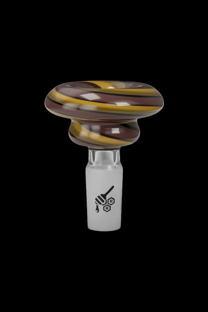 A glass cannabis bowl with swirling amber and brown colors, featuring a branded logo.