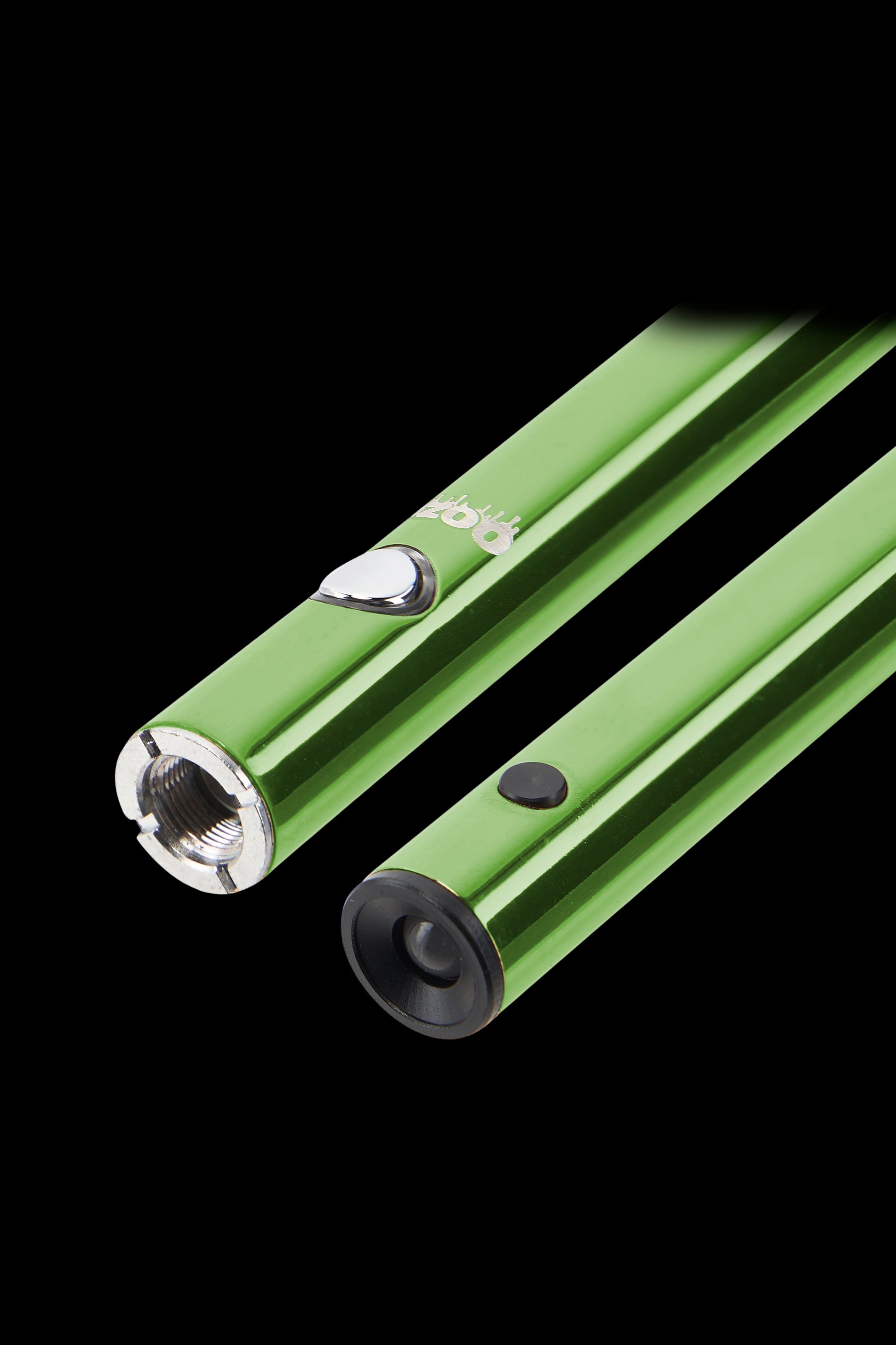 Two green cannabis vape pen batteries lie diagonally against a black background.