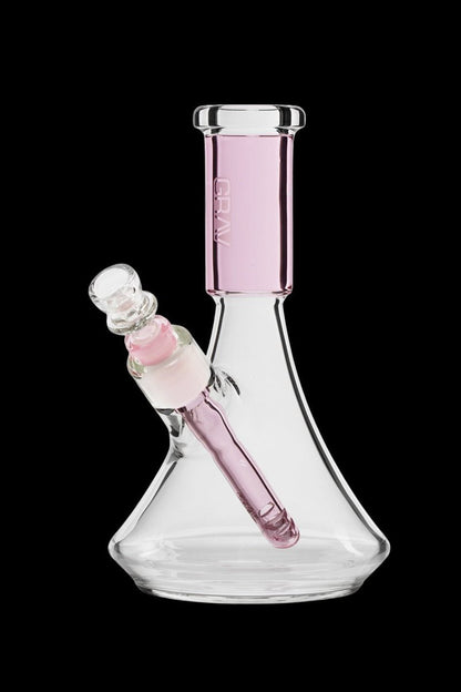 Pink glass beaker bong with ice catcher.