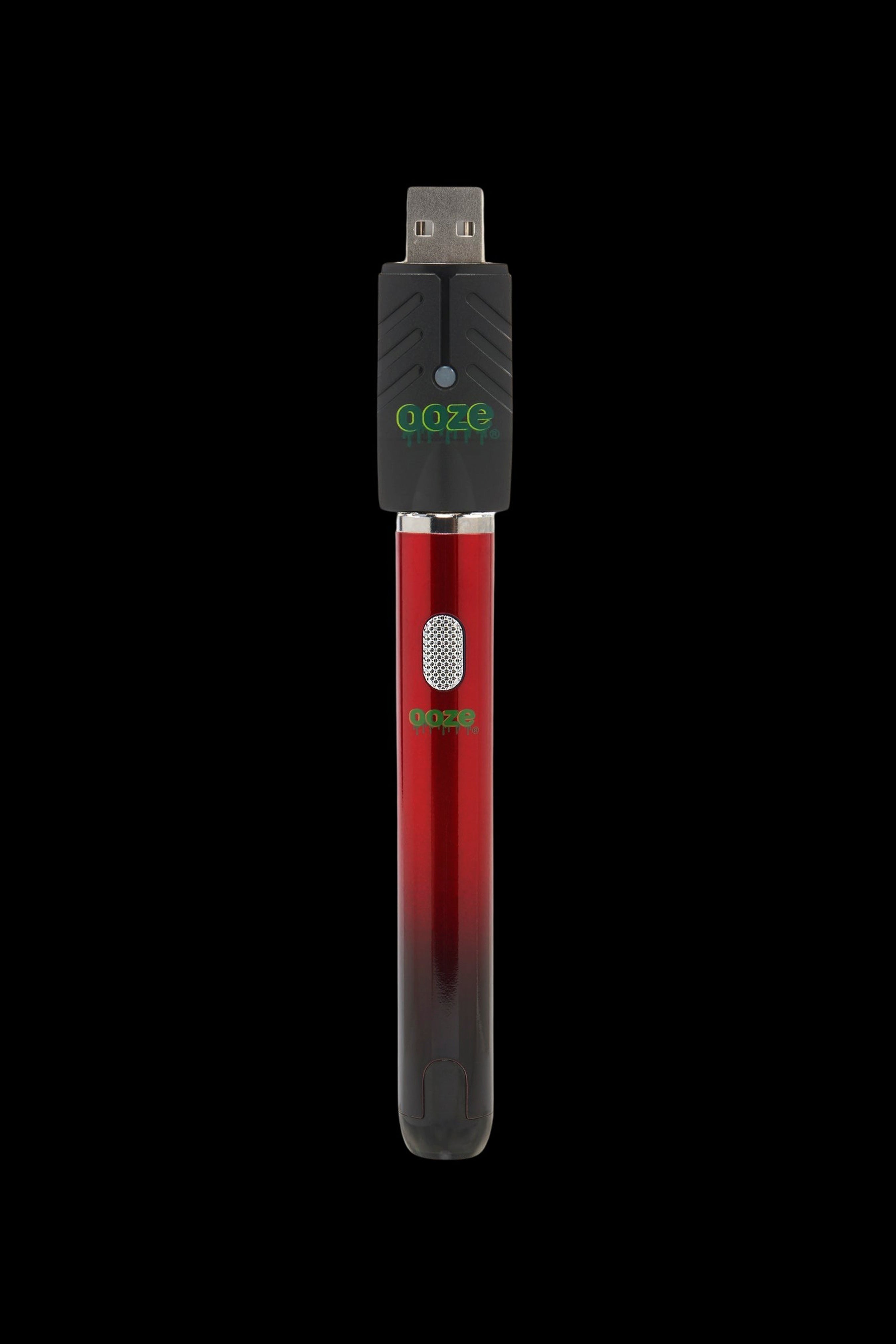 Red Goze pen-style cannabis oil vape battery with USB charging.