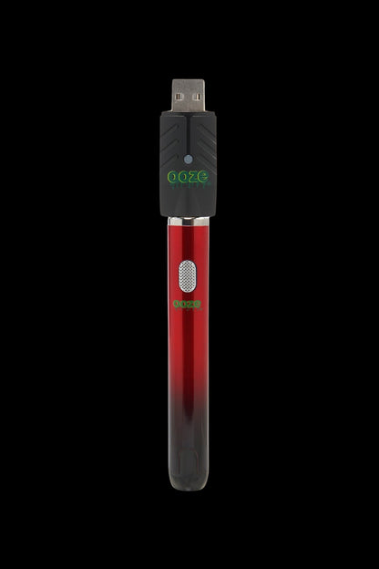 Red Goze pen-style cannabis oil vape battery with USB charging.