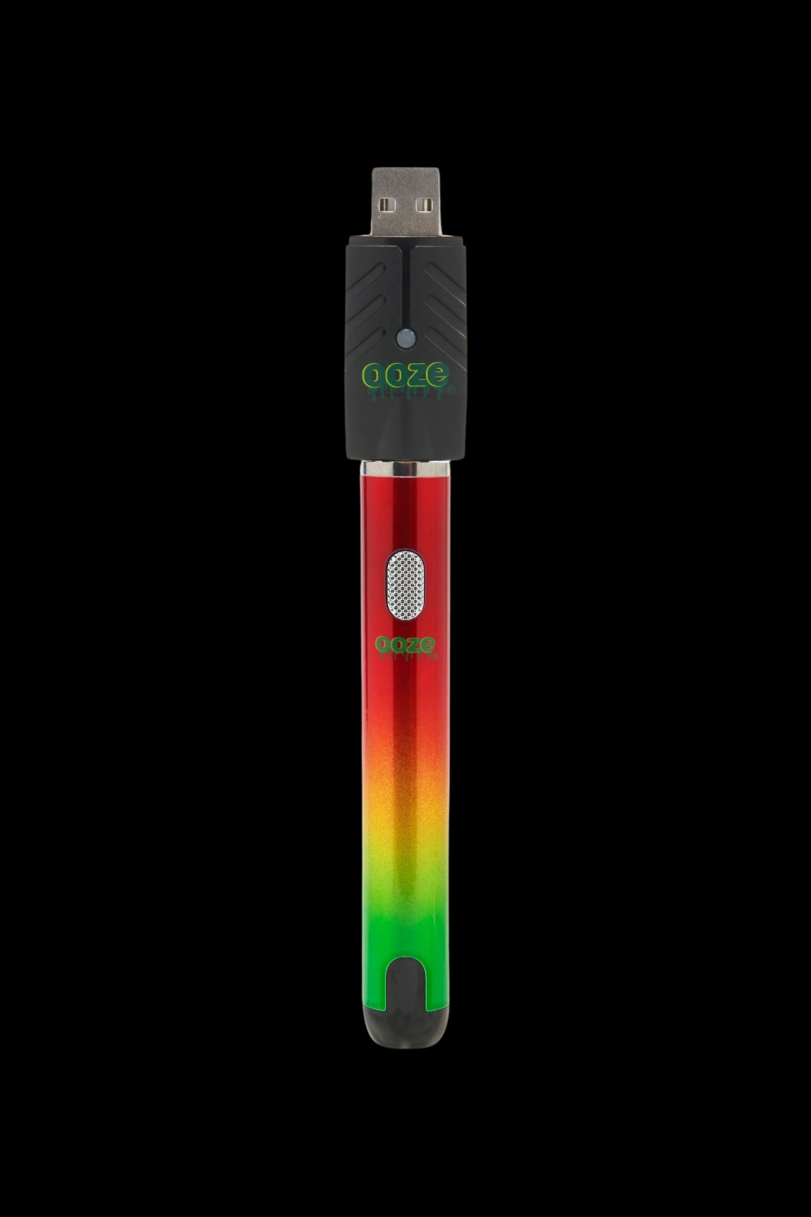 Ooze pen-style vape battery with USB charger, red and green gradient.