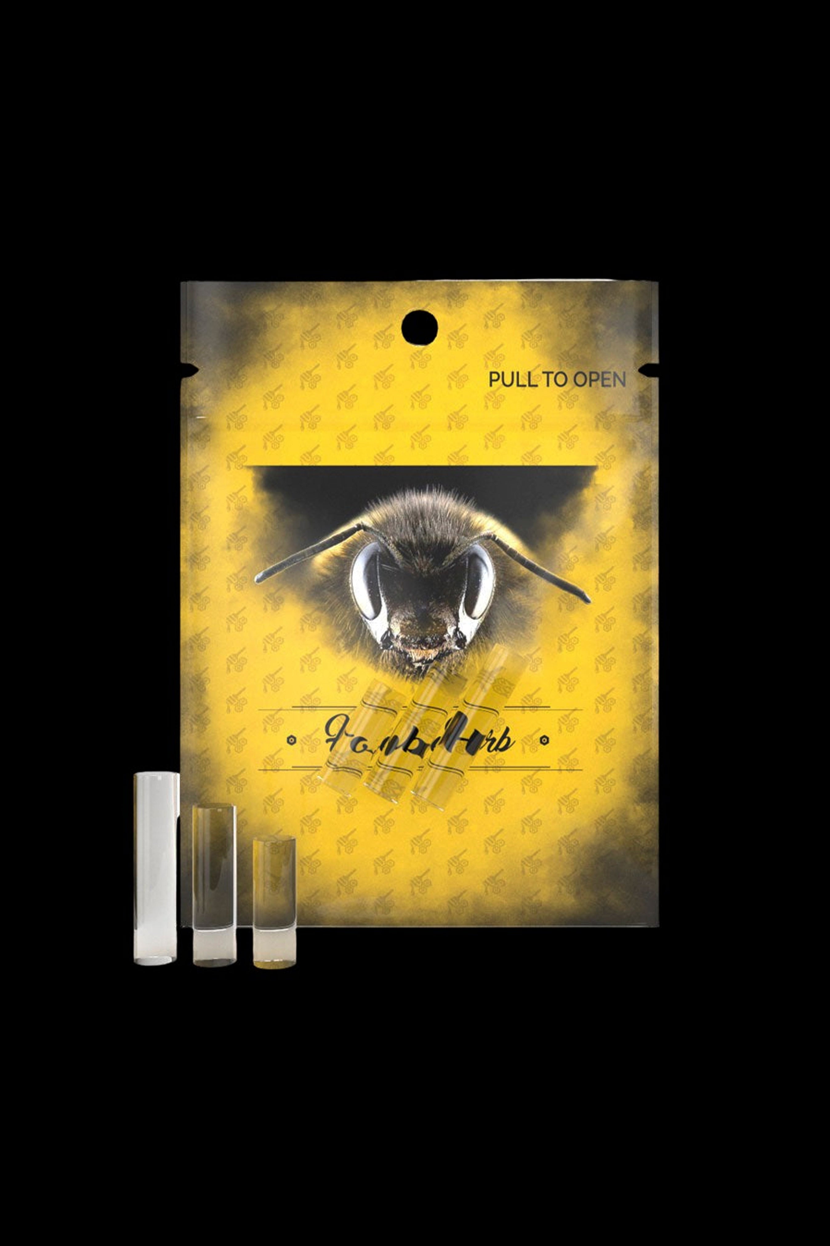 Yellow cannabis packaging featuring a bee illustration and three small cannabis oil vials.