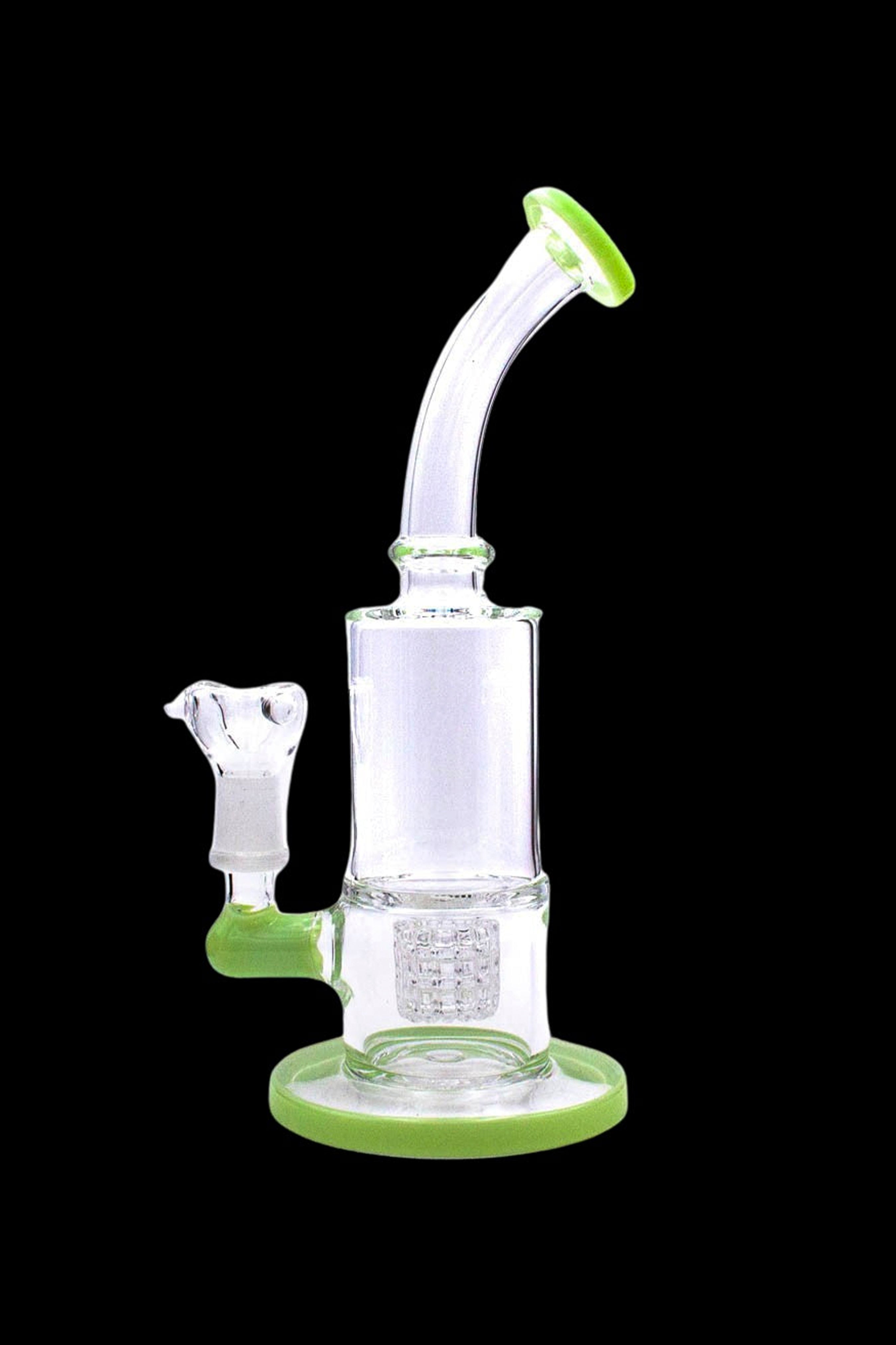 Green and clear glass water pipe (bong) with intricate design.