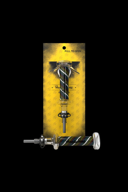 A packaged cannabis oil burner with a patterned yellow and black background.