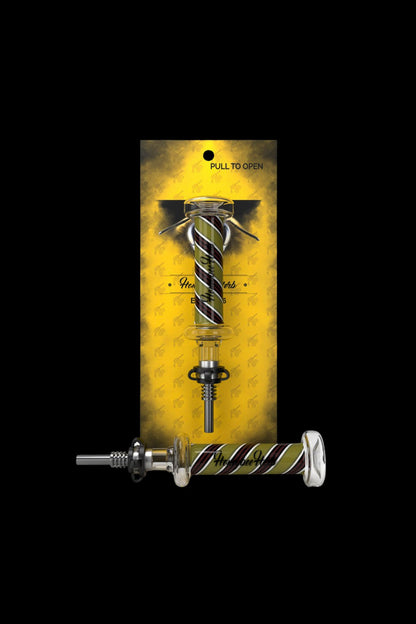 Gold cannabis dab tool with a coiled snake design, displayed in a patterned package.
