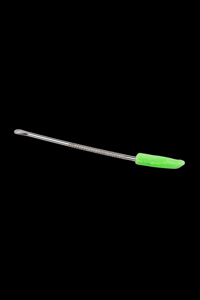 Green and silver dab tool on a black background.