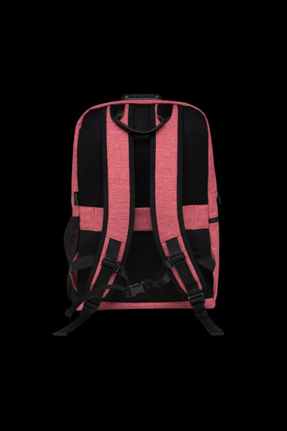 Rear view of the Ooze Traveler Smell Proof Backpack showing its Desert Sand-colored padded shoulder straps, black mesh back panels, and top carry handle against a black background.