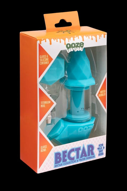Blue “Bectar” water bubbler for wax and dry herb in retail packaging.