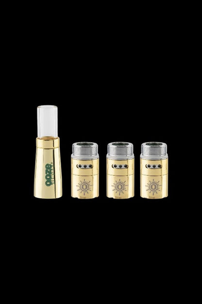 Gold cannabis oil cartridges and a charging base.