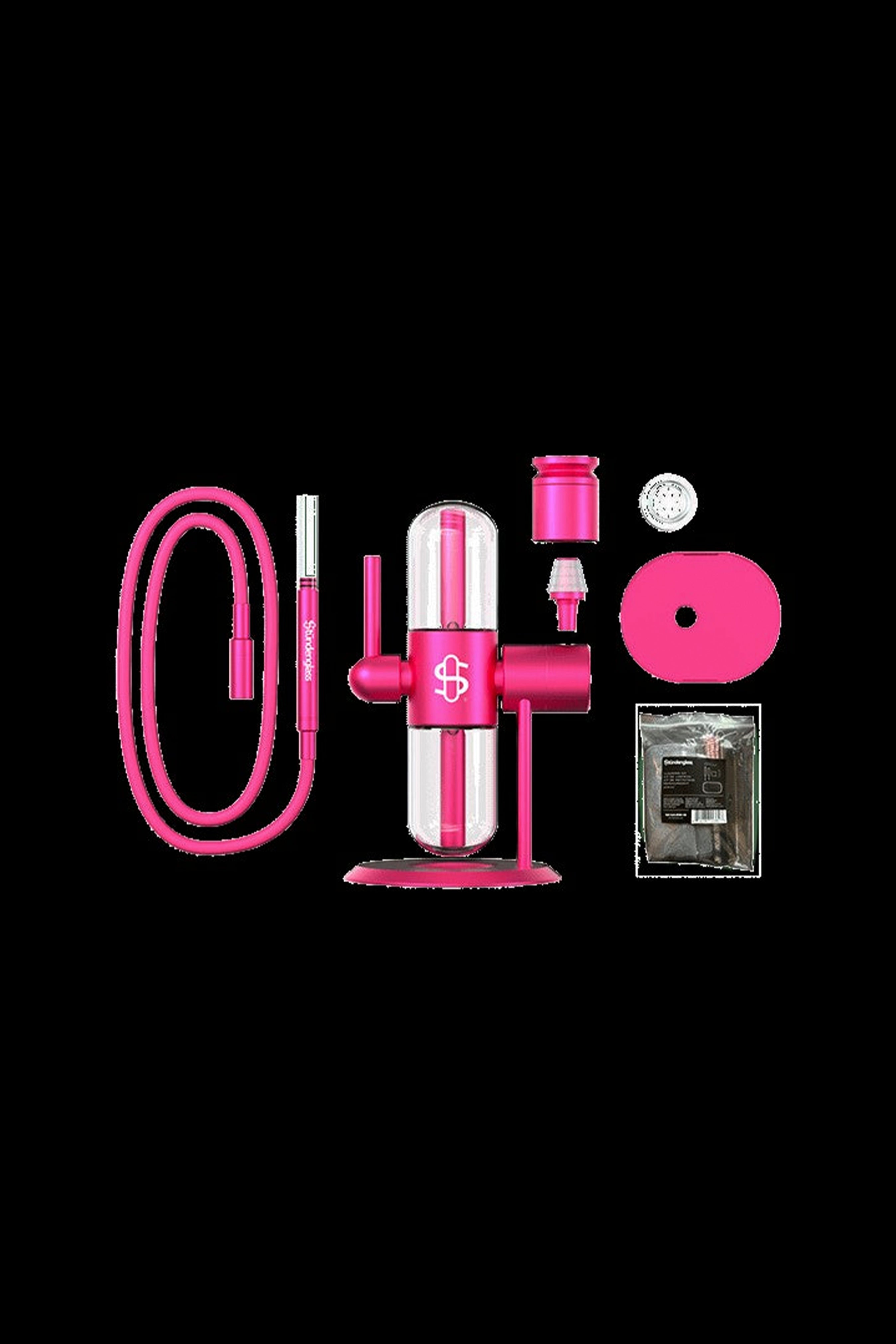 Pink cannabis dab rig with accessories including a coil, carb cap, and packaging."