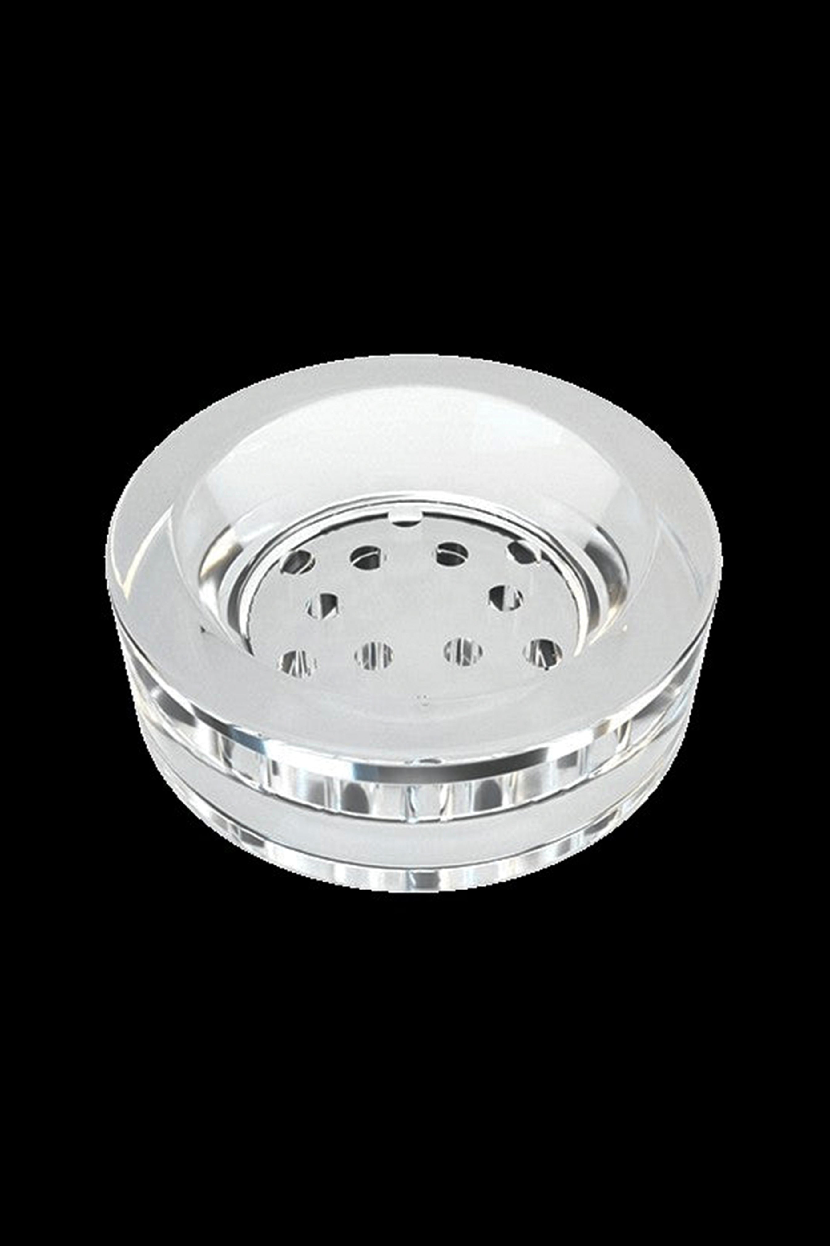 Clear glass dab cap with multiple air holes.