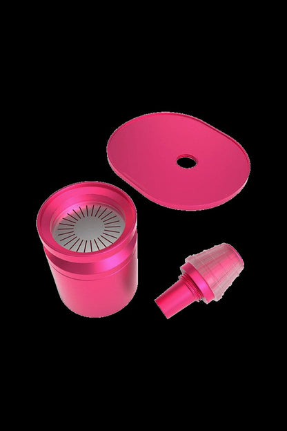 Pink cannabis bubbler disassembled, showing the water chamber, lid, and mouthpiece.