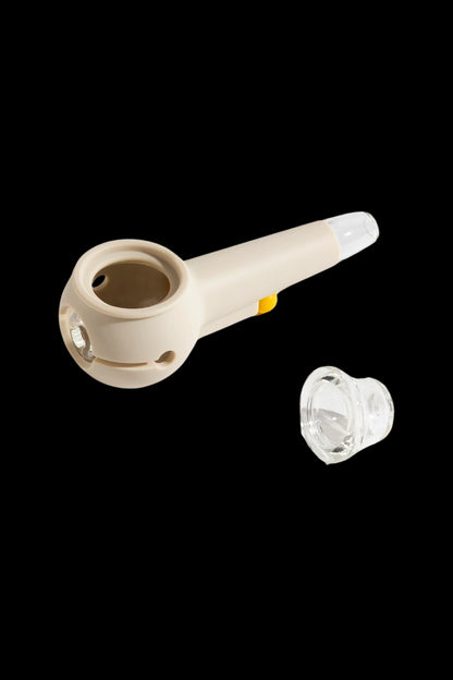 Beige silicone pipe with a glass bowl insert, isolated on a black background.