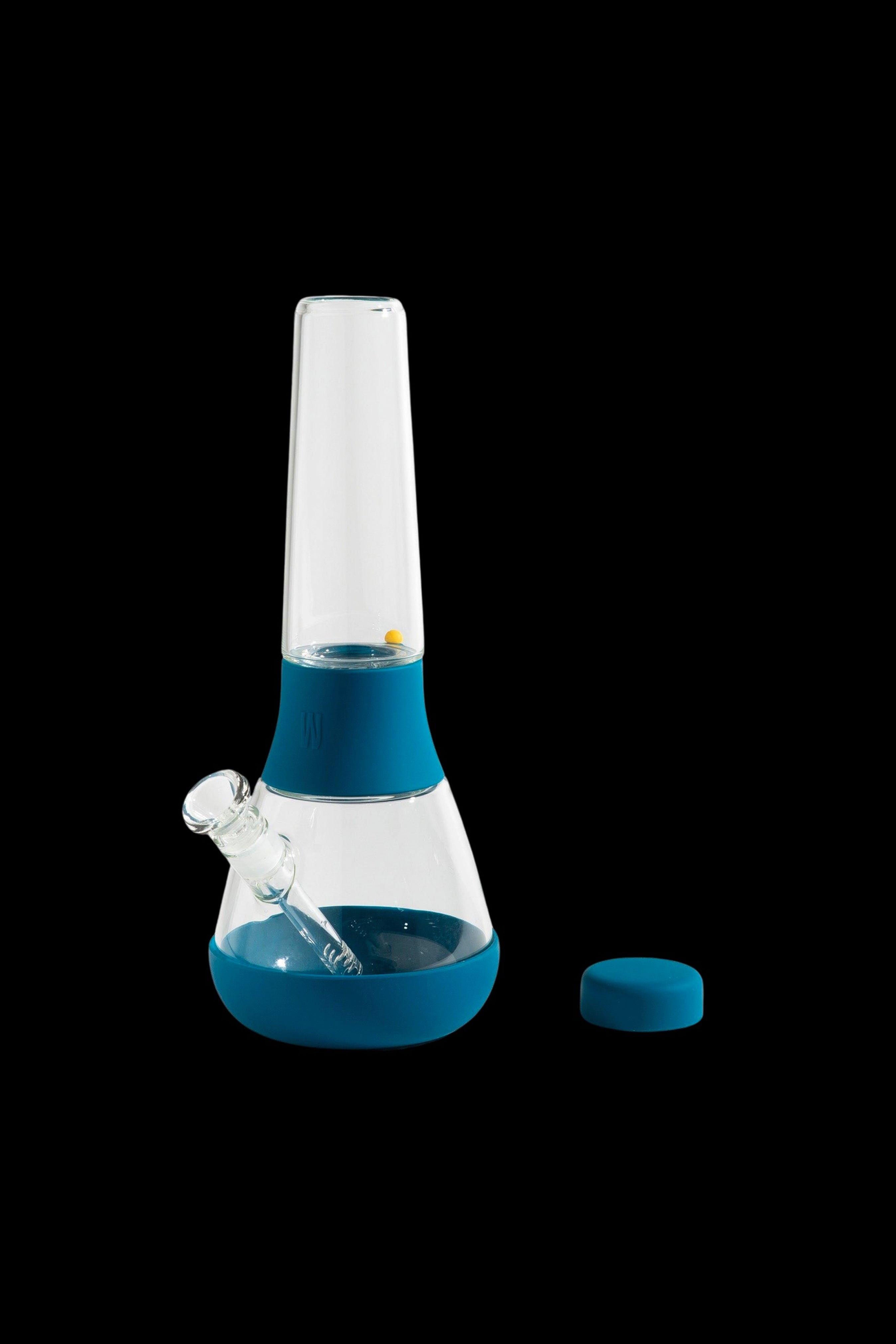 Blue silicone bong with a glass insert and detachable downstem.