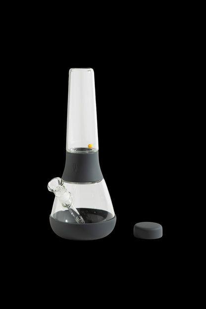 Black silicone bong with a glass chamber and downstem.