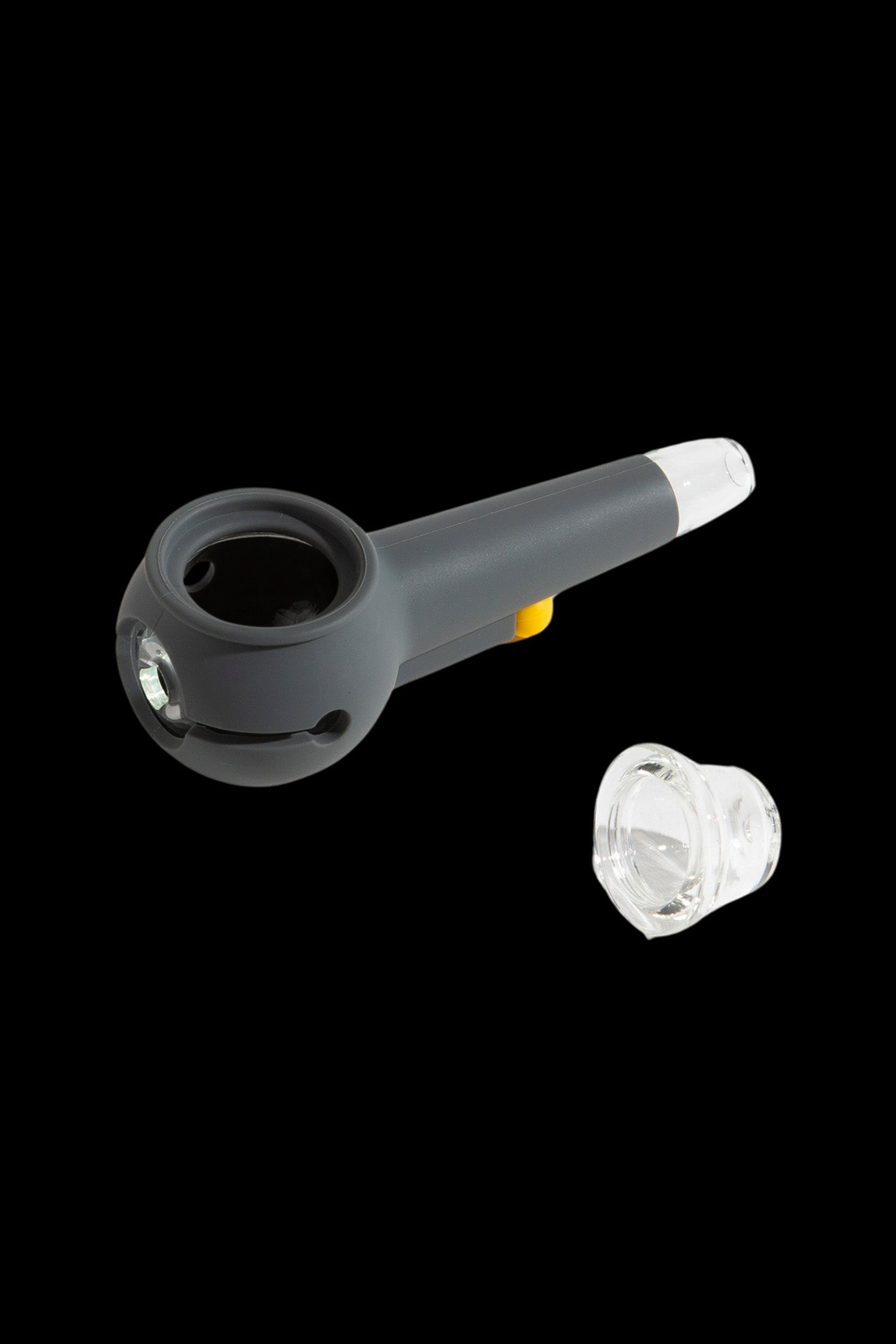 Black silicone nectar collector with a detachable glass tip and a separate clear quartz tip.