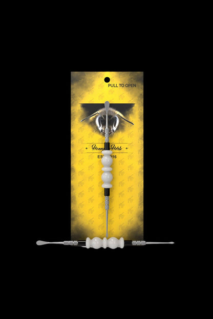 Cannabis oil applicator with a bee-themed package labeled “Honey Herbs.”