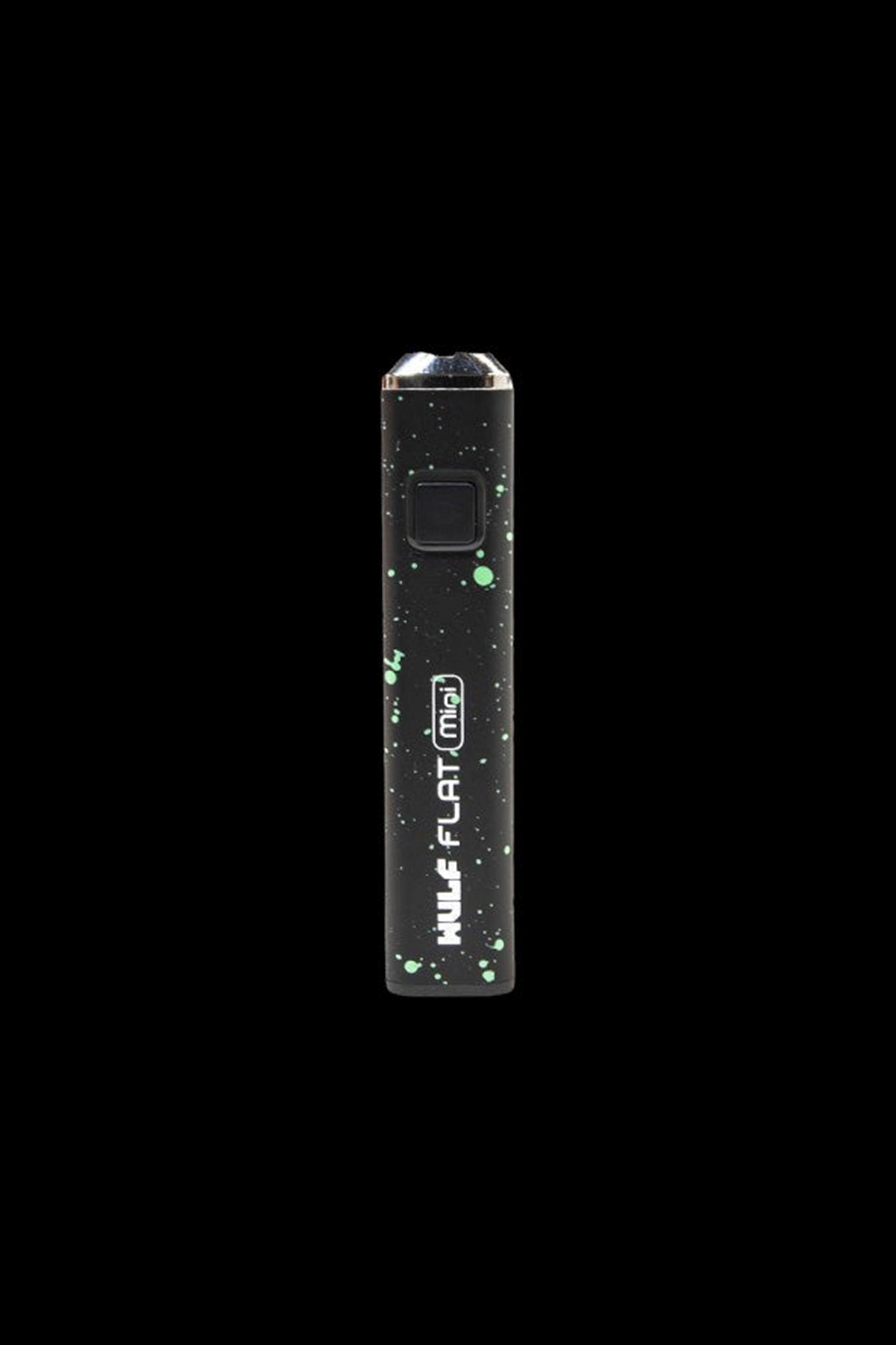 Black cannabis vape pen with green splatter design.