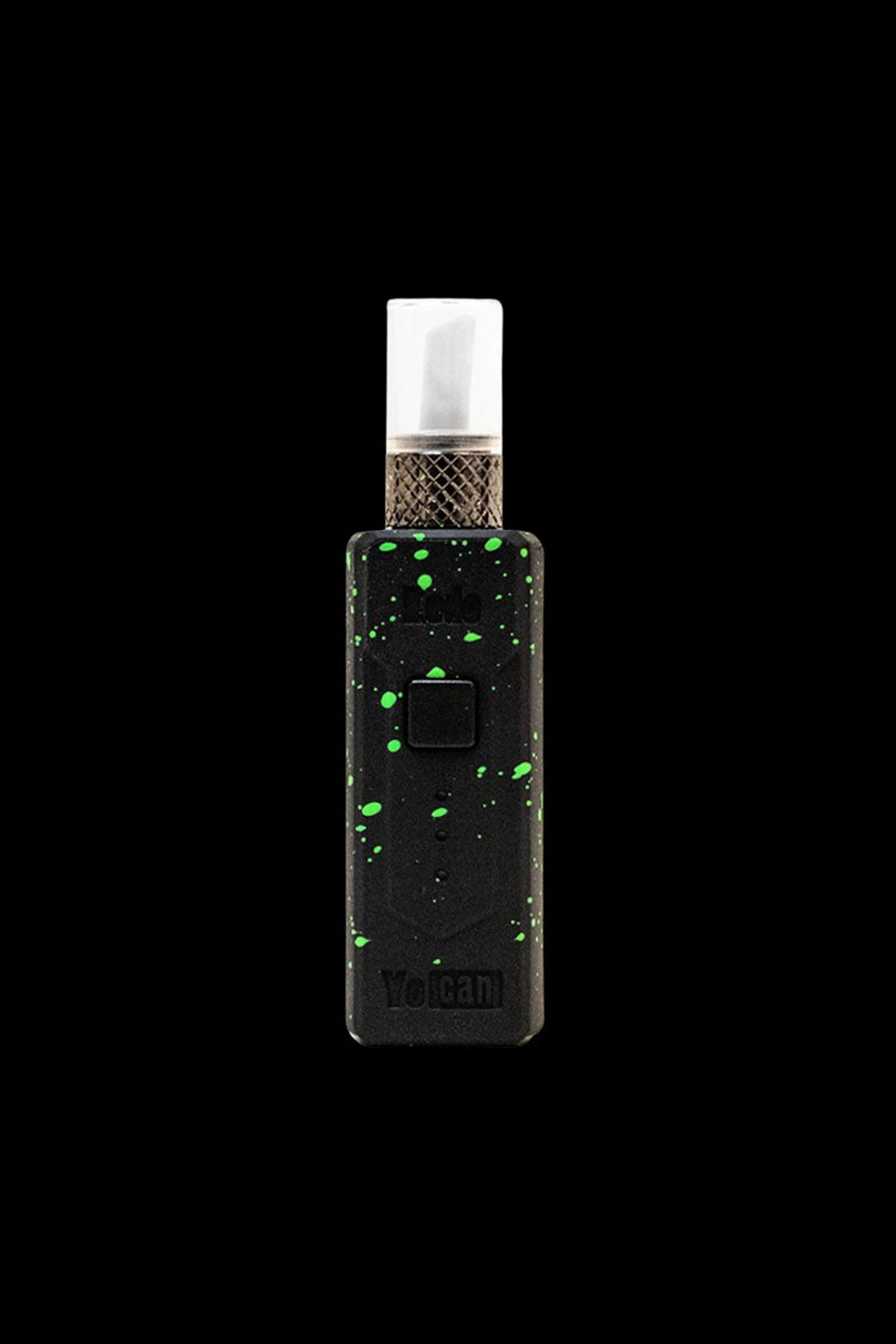 Black and green cannabis oil vape pen with a glass mouthpiece, displaying the “Yocan” logo.