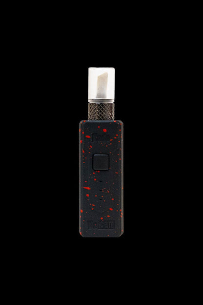 Black and red cannabis dab pen with a white ceramic tip isolated on a black background.