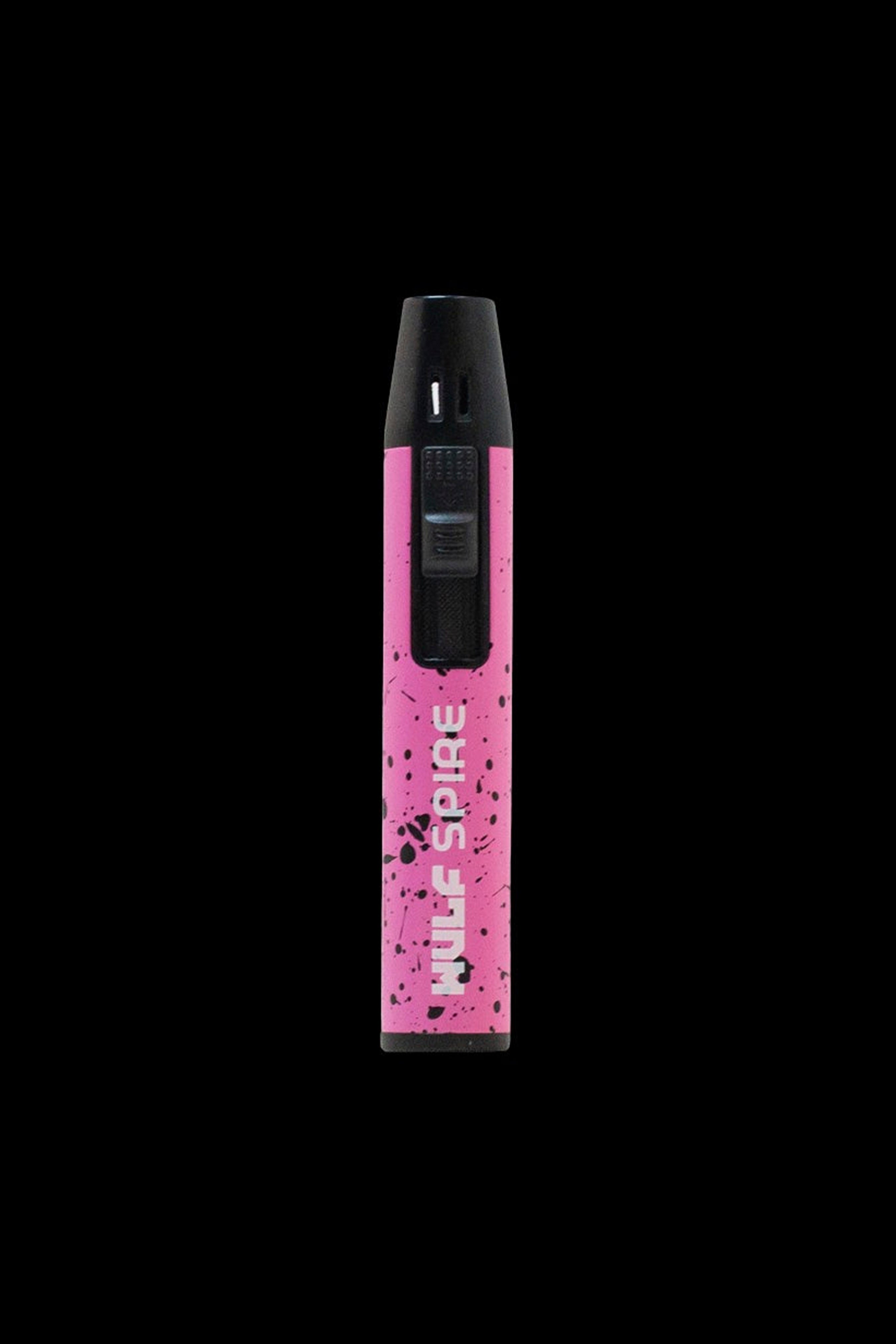 Pink cannabis vape pen with “Nule Spire” branding against a black background.