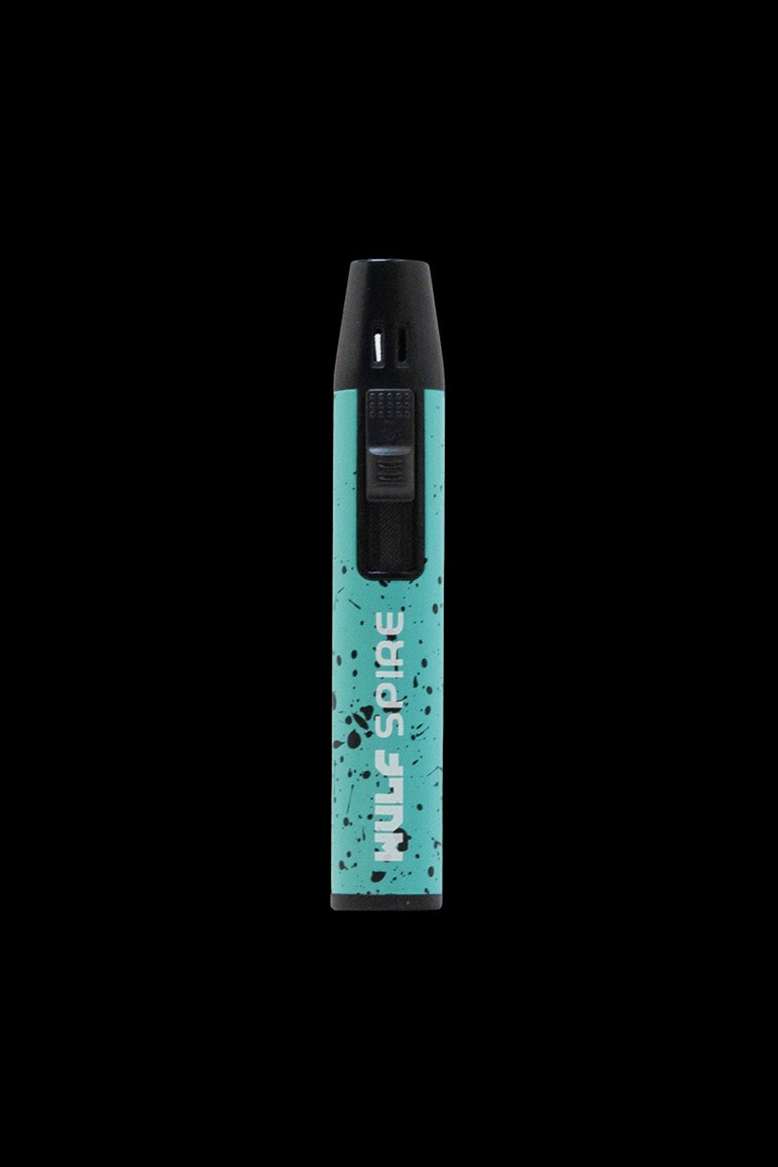 A teal and black cannabis vape pen with "Nule Spire" printed vertically on its side, isolated on a black background.