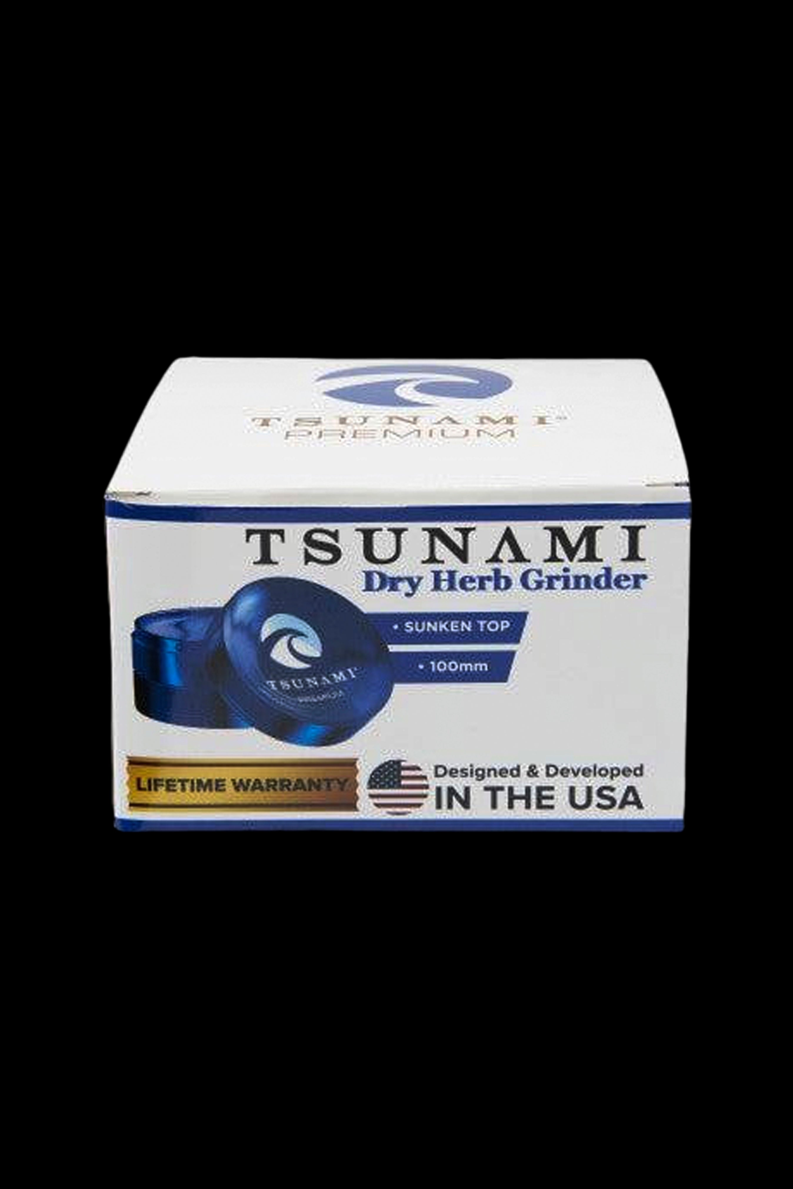 Tsunami Premium dry herb grinder packaging, featuring a blue grinder and “Lifetime Warranty” seal.