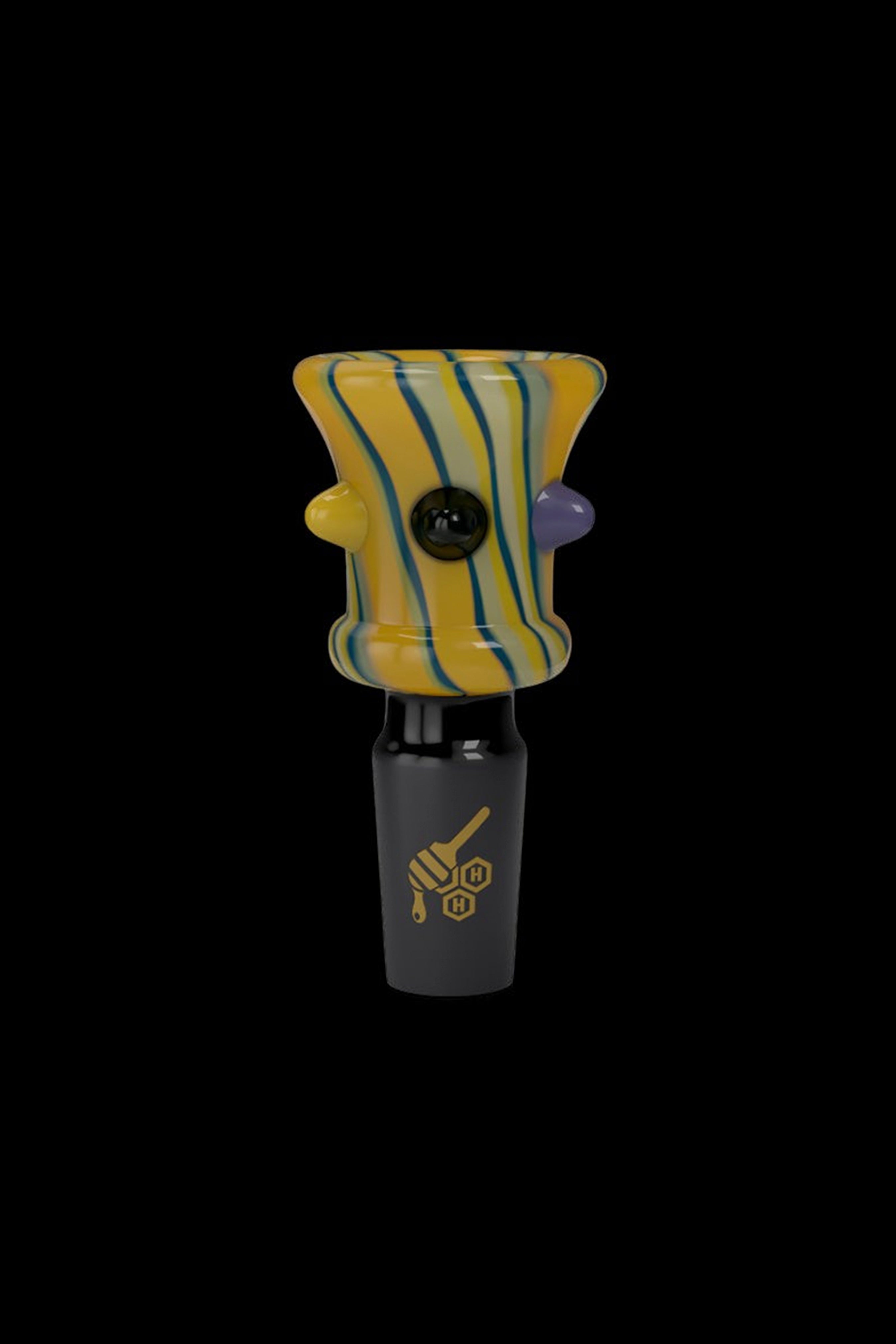 Hand-blown glass cannabis oil rig with yellow and blue striped bubbler and black water pipe base.