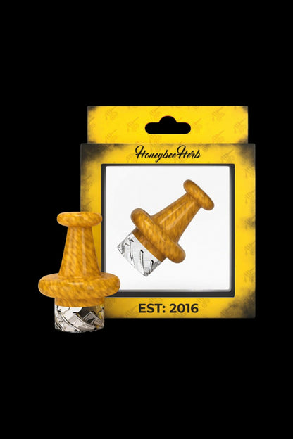 Close-up front view of the yellow Honeybee Herb Colorful Classic Vortex Carb Cap against its branded yellow box.