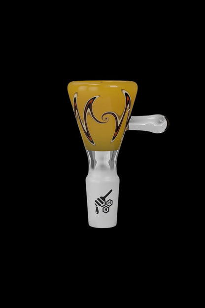 Glass cannabis bowl with amber and black swirl design.