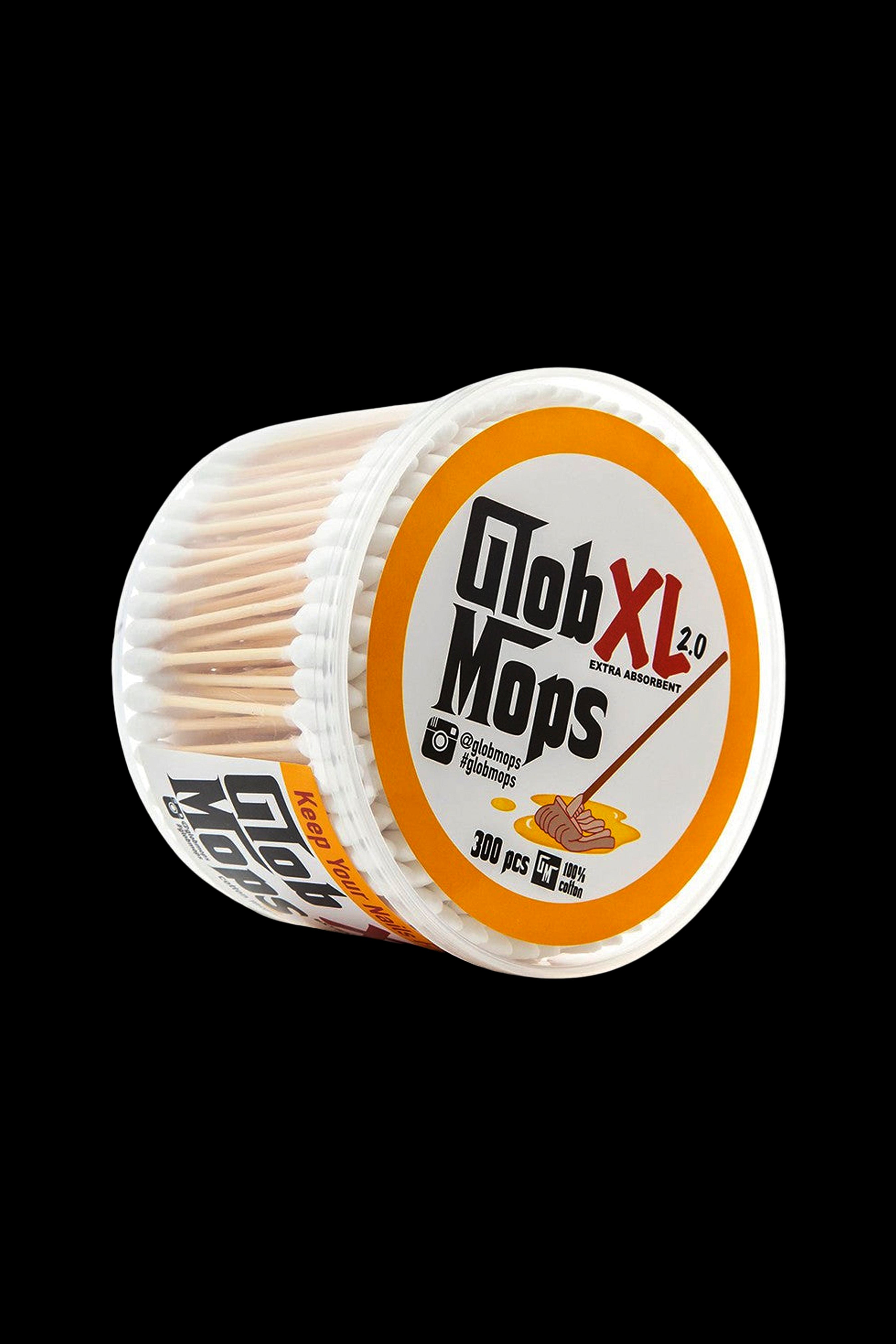 A roll of “Glob Mops” – small, cylindrical cotton swabs used for cleaning cannabis accessories – against a black background.