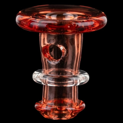 Close-up front view of the Empire Glassworks PuffCo 'New Peak' & Proxy Glass Joystick Cap - Translucent Red showing glossy red-tinted glass, a central hole, and reflective ring details against a black background