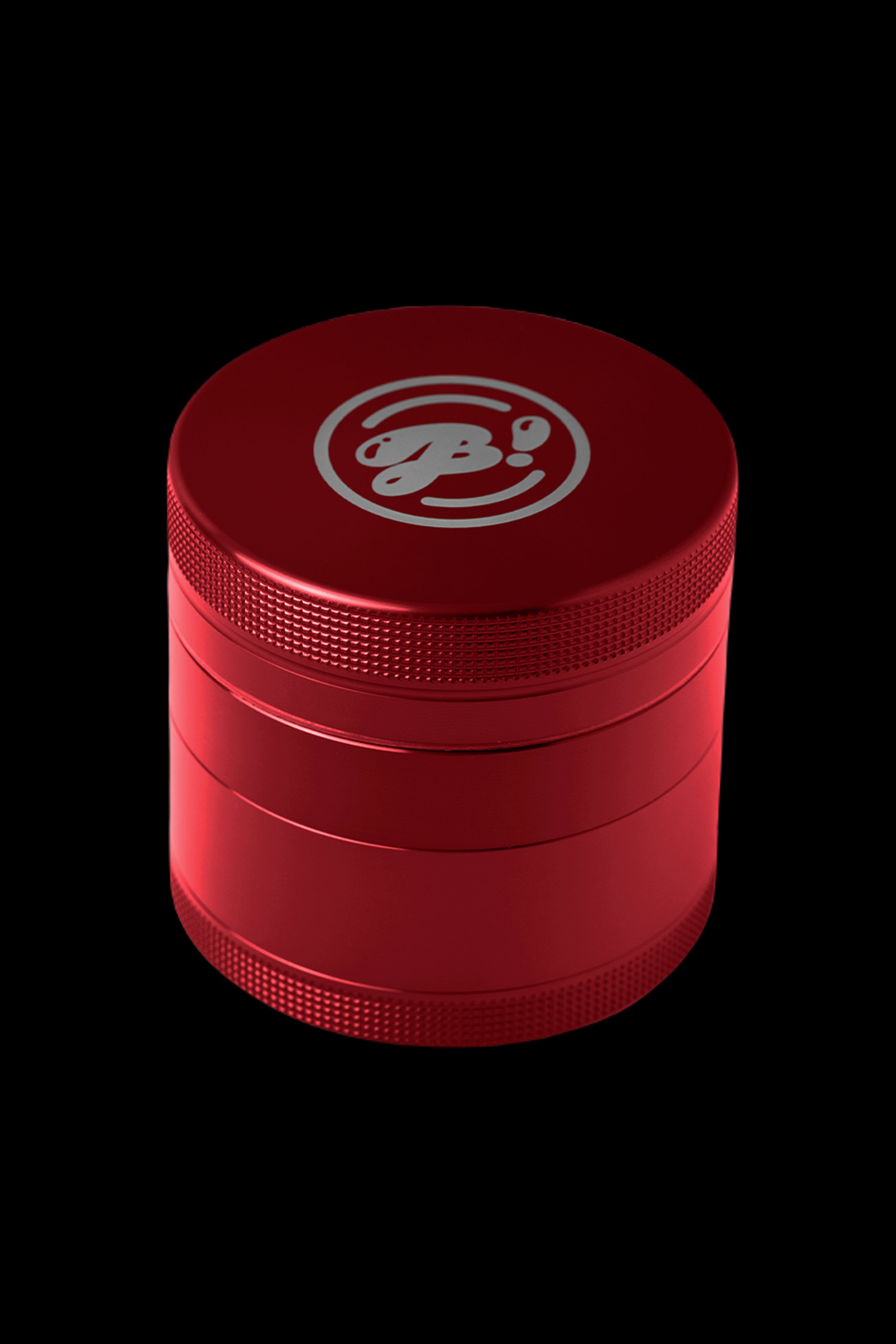 Red four-piece cannabis grinder with a silver logo.