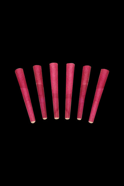 Seven pre-rolled, maroon-colored cannabis cones against a black background.