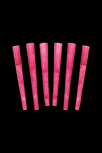 Pink pre-rolled cones against a black background.
