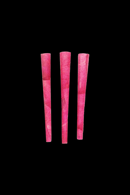 Three pink pre-rolled cones against a black background.