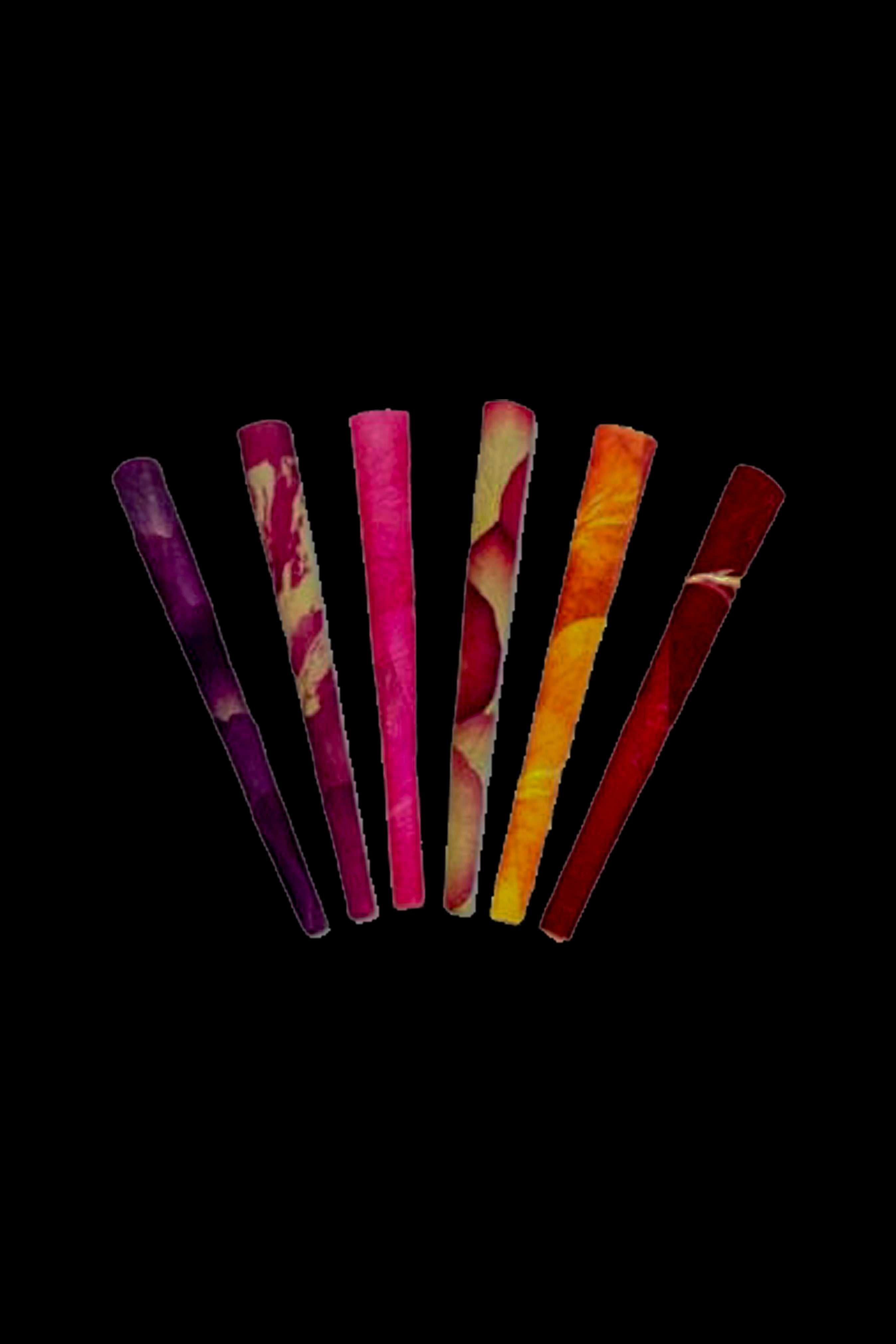 Colorful pre-rolled cones fanned out against a black background.