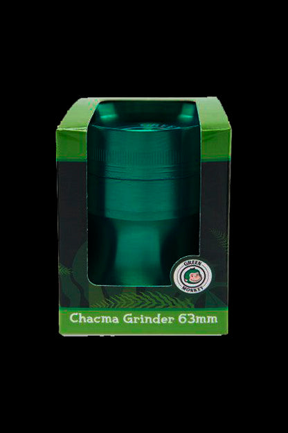 Close-up front view of a metallic green Green Monkey Chacma Grinder with Ashtray shown inside its green display box.