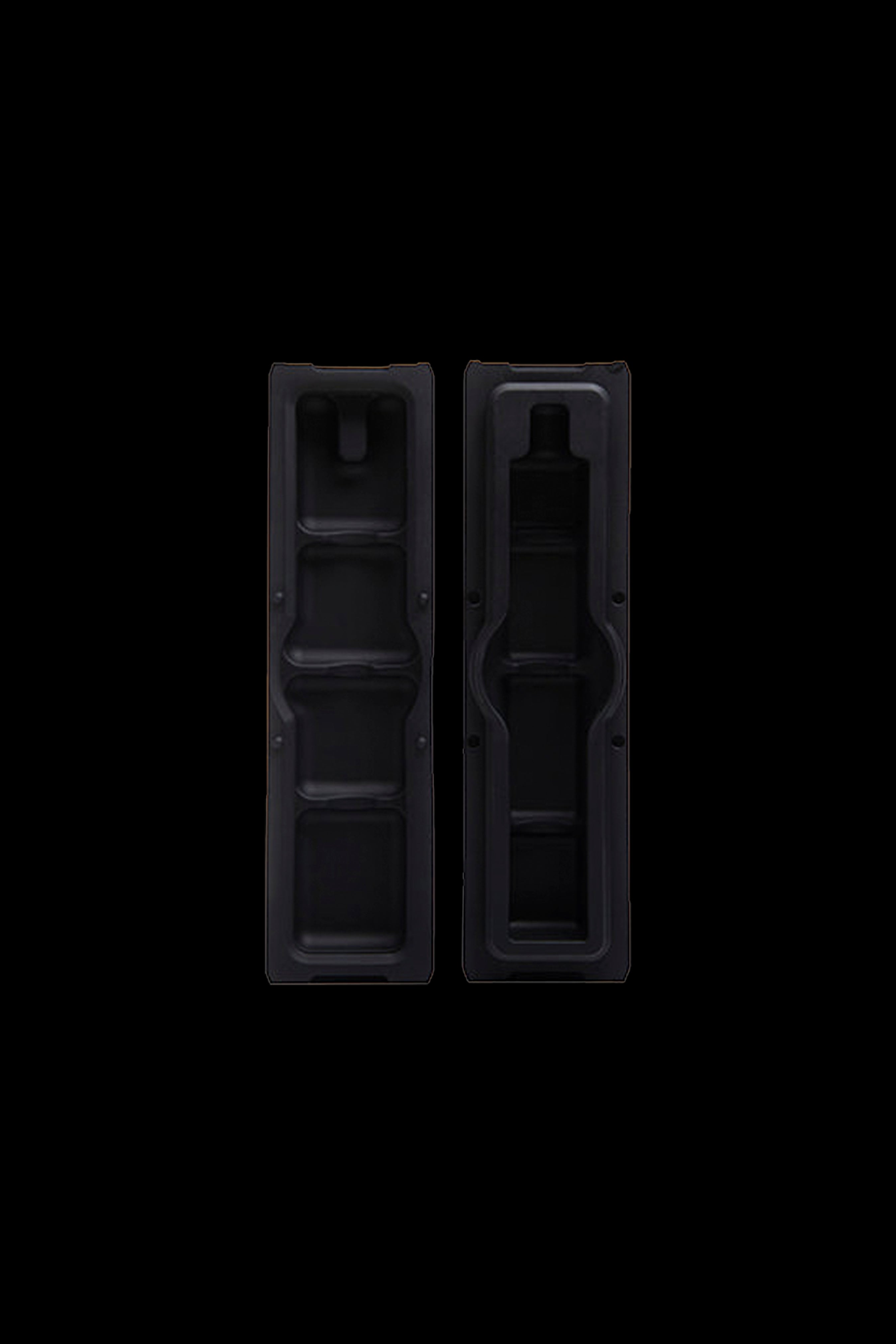 Black plastic inserts for organizing cannabis concentrates or accessories.