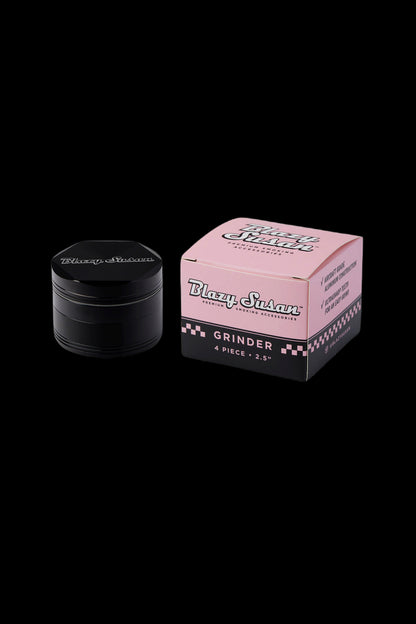 Blazy Susan grinder and box on a black background.