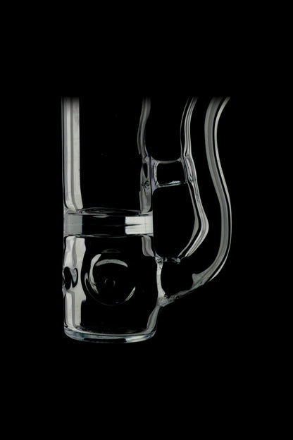 Clear glass water pipe (rig) with intricate design, isolated on black.