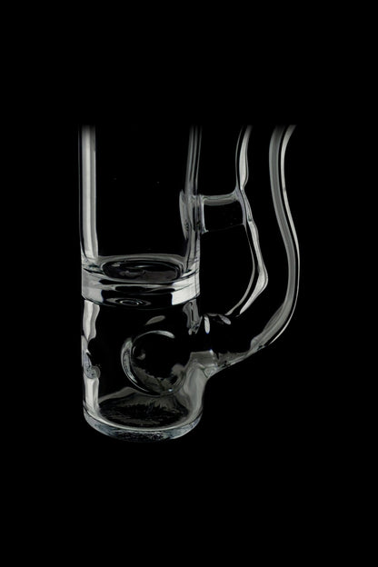 Clear glass water pipe (bong) with intricate swirling design, isolated on black.